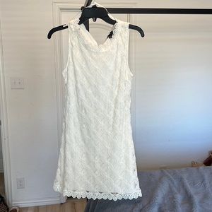 Can be a casual or dressy dress, lace details, rhinestone button in the back,